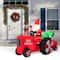 Glitzhome® 11ft. Lighted Inflatable Santa on Tractor Décor